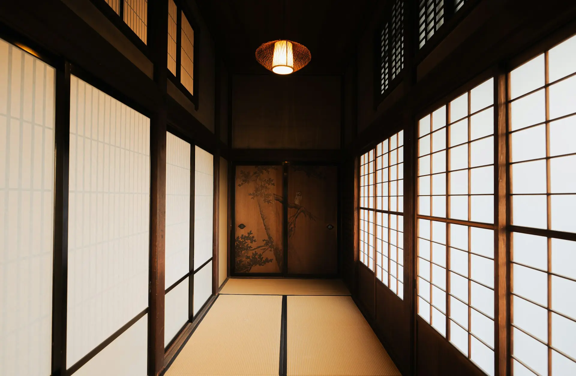 a hallway with a light hanging from the ceiling